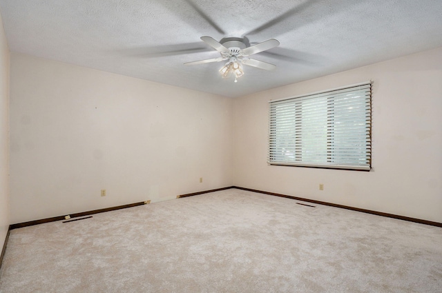 3520 E Carol Dr, Springfield, MO 65809 - empty room with ceiling fan, carpet, and a textured ceiling