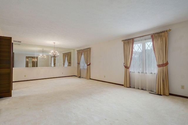 3520 E Carol Dr, Springfield, MO 65809 - carpeted spare room featuring a chandelier and baseboards