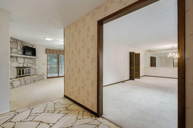 3520 E Carol Dr, Springfield, MO 65809 - corridor featuring light carpet, a chandelier, and wallpapered walls