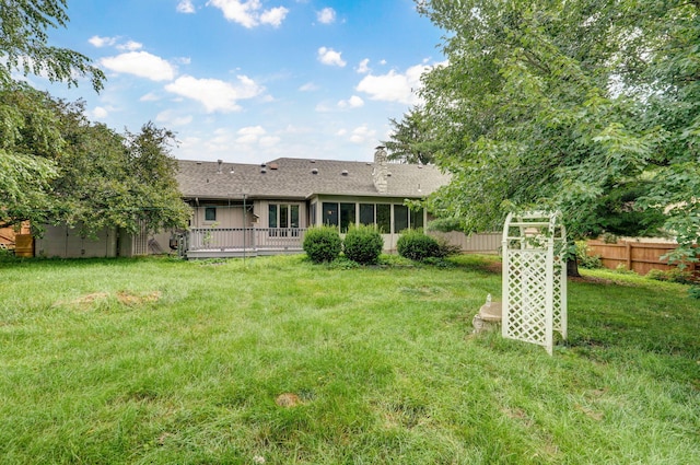 3520 E Carol Dr, Springfield, MO 65809 - rear view of house featuring a shingled roof, a sunroom, and a chimney