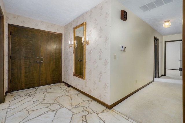 3520 E Carol Dr, Springfield, MO 65809 - hallway with light carpet and wallpapered walls