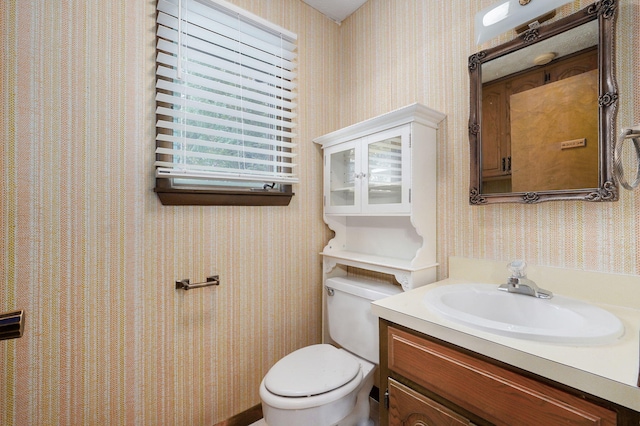 3520 E Carol Dr, Springfield, MO 65809 - bathroom featuring wallpapered walls and vanity