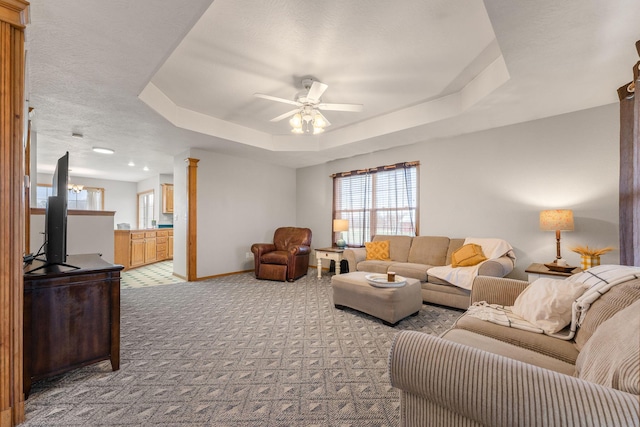 2131 Redoak Rd, Fordland, MO 65652 - living room with light colored carpet, ceiling fan, and a tray ceiling