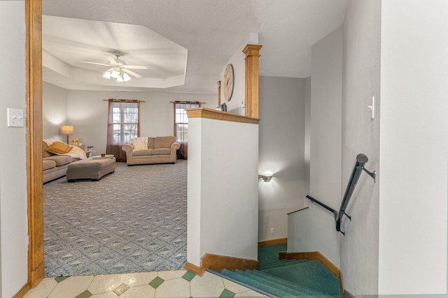 2131 Redoak Rd, Fordland, MO 65652 - staircase with carpet, a ceiling fan, a raised ceiling, and tile patterned floors