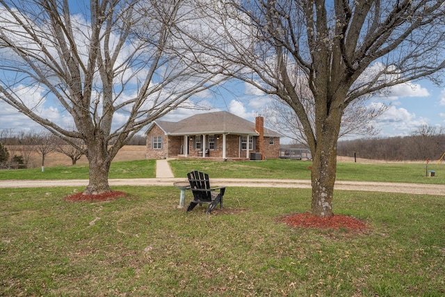 2131 Redoak Rd, Fordland, MO 65652 - view of front facade with a chimney, a front lawn, brick siding, and a porch