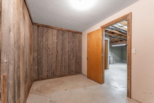 2131 Redoak Rd, Fordland, MO 65652 - below grade area featuring wooden walls and a textured ceiling
