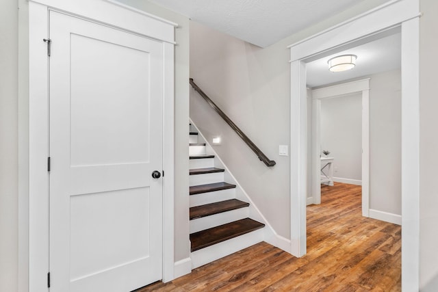 6421 S Valley Brook Ct, Springfield, MO 65810 - staircase with wood finished floors and baseboards
