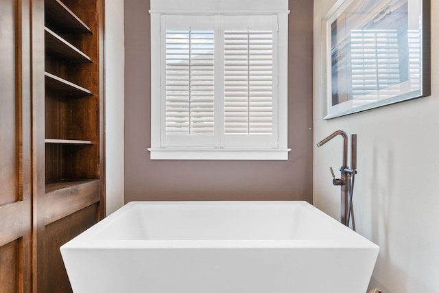 6421 S Valley Brook Ct, Springfield, MO 65810 - bathroom with a soaking tub and plenty of natural light