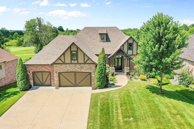 6421 S Valley Brook Ct, Springfield, MO 65810 - english style home featuring concrete driveway, a front lawn, stone siding, and a garage