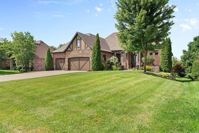 6421 S Valley Brook Ct, Springfield, MO 65810 - tudor-style house with stone siding, an attached garage, driveway, and a front yard
