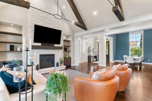 6421 S Valley Brook Ct, Springfield, MO 65810 - living area featuring wood finished floors, beamed ceiling, a fireplace, built in shelves, and high vaulted ceiling