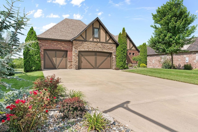6421 S Valley Brook Ct, Springfield, MO 65810 - english style home with stucco siding, stone siding, driveway, a garage, and a front lawn