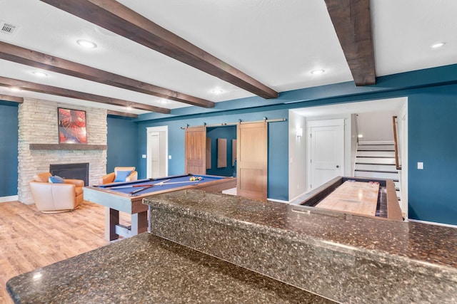 6421 S Valley Brook Ct, Springfield, MO 65810 - recreation room featuring beamed ceiling, a fireplace, wood finished floors, a barn door, and pool table