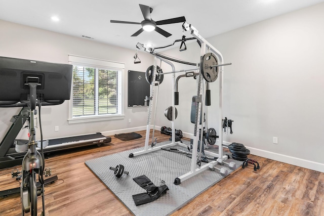 6421 S Valley Brook Ct, Springfield, MO 65810 - workout area featuring ceiling fan and wood finished floors
