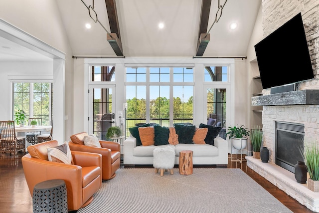 6421 S Valley Brook Ct, Springfield, MO 65810 - living area with high vaulted ceiling, beamed ceiling, a fireplace, wood finished floors, and recessed lighting