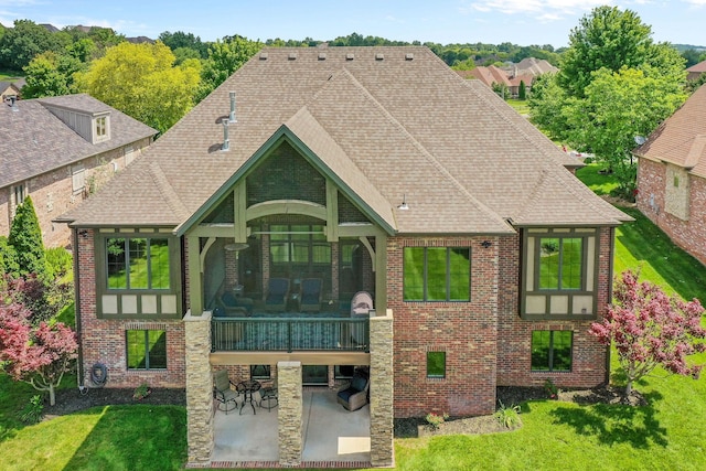 6421 S Valley Brook Ct, Springfield, MO 65810 - view of front of property featuring a patio, brick siding, a front lawn, and a shingled roof