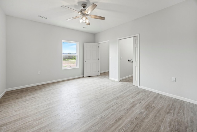 unfurnished bedroom with light wood-type flooring and ceiling fan