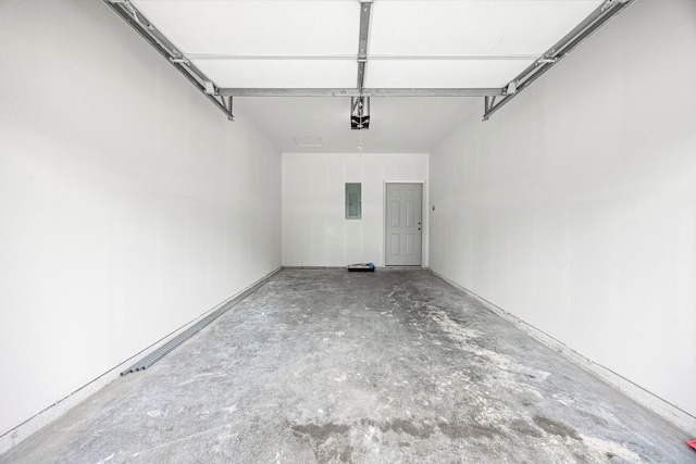 garage with electric panel and a garage door opener