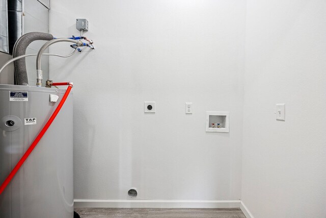 washroom with gas water heater, electric dryer hookup, washer hookup, and wood finished floors