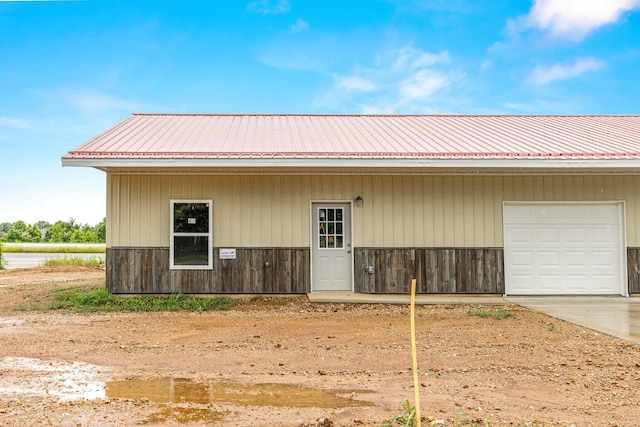 view of outbuilding with driveway and a garage