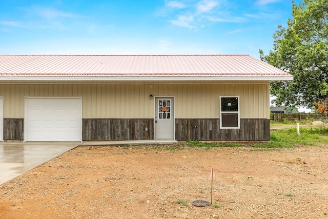 garage with concrete driveway