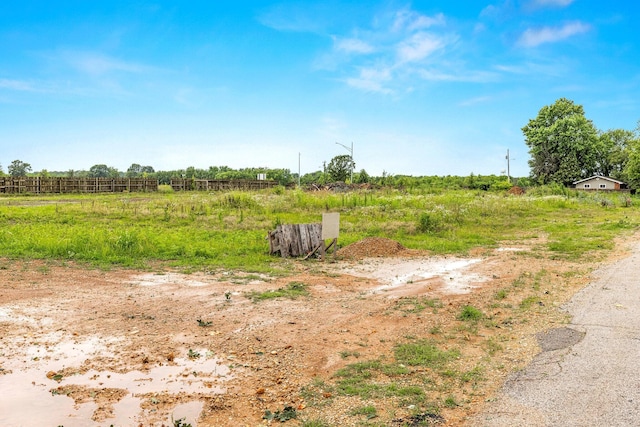 view of yard with a rural view