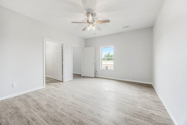 unfurnished bedroom featuring light wood-style flooring and a ceiling fan