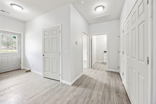 entrance foyer with light wood-style flooring