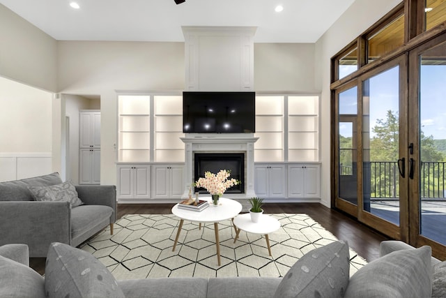 564 Marcasite Way, Branson West, MO 65737 - living area with wood finished floors, recessed lighting, a fireplace with raised hearth, and french doors