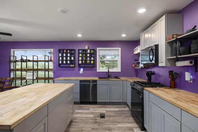 2080 State Route 14, West Plains, MO 65775 - kitchen featuring wooden counters, black appliances, open shelves, and recessed lighting