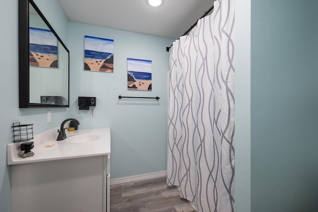 2080 State Route 14, West Plains, MO 65775 - bathroom with vanity, wood finished floors, curtained shower, and recessed lighting