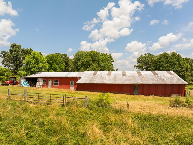 2080 State Route 14, West Plains, MO 65775 - view of front of house featuring a pole building and an outbuilding