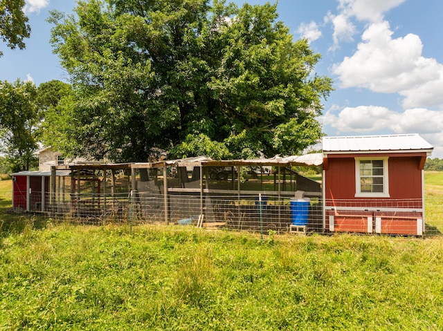 2080 State Route 14, West Plains, MO 65775 - view of front of house with exterior structure, an outbuilding, and a metal roof