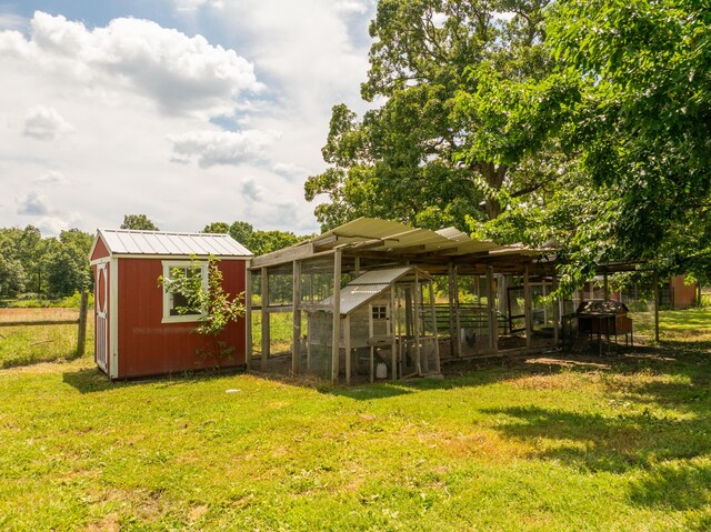 2080 State Route 14, West Plains, MO 65775 - view of grassy yard with exterior structure and an outbuilding