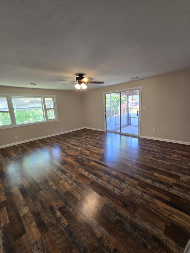 1008 3rd St, Monett, MO 65708 - unfurnished room with dark wood finished floors and ceiling fan