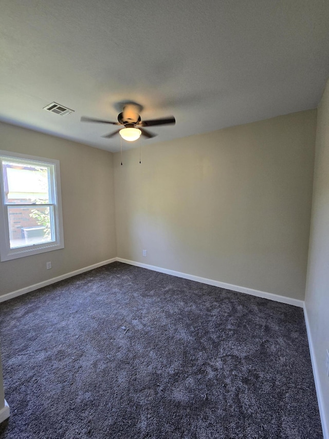 1008 3rd St, Monett, MO 65708 - empty room with a ceiling fan and dark carpet
