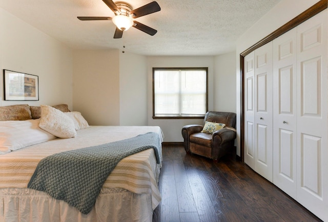 9755 State Highway 13, Kimberling City, MO 65686 - bedroom featuring dark wood finished floors, a closet, a ceiling fan, and a textured ceiling