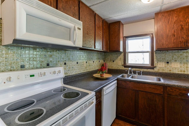 9755 State Highway 13, Kimberling City, MO 65686 - kitchen with white appliances, dark countertops, and tasteful backsplash