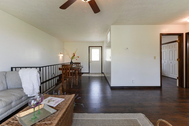 9755 State Highway 13, Kimberling City, MO 65686 - living room featuring a ceiling fan, wood-type flooring, and a textured ceiling