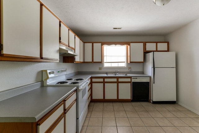 9755 State Highway 13, Kimberling City, MO 65686 - kitchen featuring white appliances, under cabinet range hood, light countertops, light tile patterned floors, and a textured ceiling