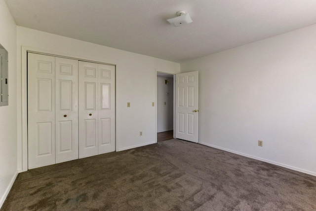 9755 State Highway 13, Kimberling City, MO 65686 - unfurnished bedroom with dark colored carpet and a closet