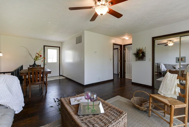 9755 State Highway 13, Kimberling City, MO 65686 - living area featuring a ceiling fan, hardwood / wood-style floors, and a textured ceiling