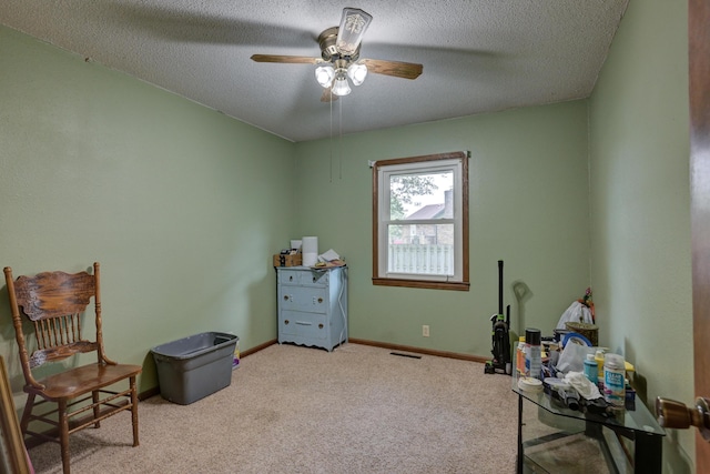 2148 Carrie St, Carthage, MO 64836 - sitting room featuring carpet flooring, a ceiling fan, and a textured ceiling