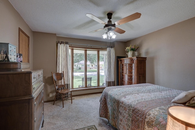 2148 Carrie St, Carthage, MO 64836 - bedroom with light carpet, a textured ceiling, and a ceiling fan