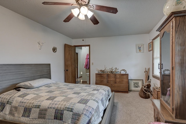 2148 Carrie St, Carthage, MO 64836 - bedroom featuring light carpet, a textured ceiling, and ceiling fan