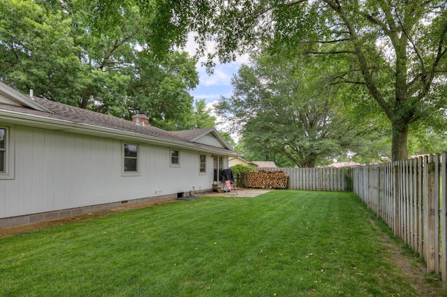 2148 Carrie St, Carthage, MO 64836 - fenced backyard with a patio area