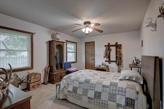 2148 Carrie St, Carthage, MO 64836 - bedroom with carpet floors, a ceiling fan, and a textured ceiling