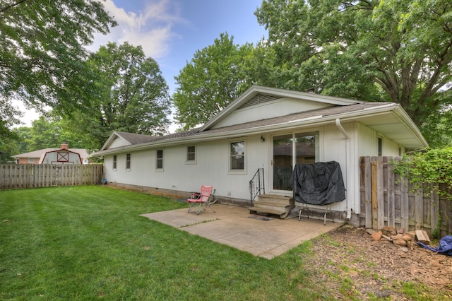 2148 Carrie St, Carthage, MO 64836 - back of house featuring entry steps, a patio area, and a shingled roof