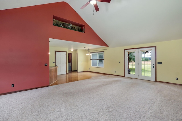 14521 Lawrence Unit 2145, Mount Vernon, MO 65712 - unfurnished living room featuring carpet floors, high vaulted ceiling, ceiling fan, and plenty of natural light