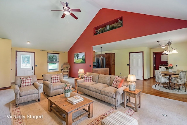14521 Lawrence Unit 2145, Mount Vernon, MO 65712 - living area featuring ceiling fan, high vaulted ceiling, and light wood finished floors